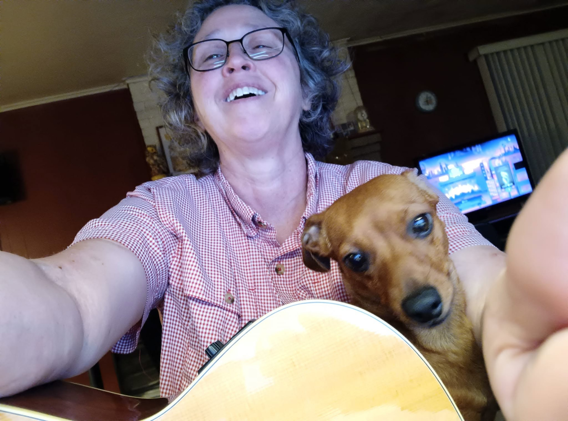 Ginger with Maebell, her dachshund, and a guitar